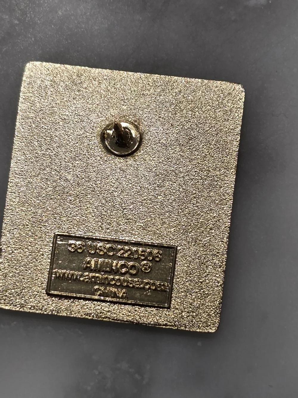 Team USA accessory is a square white enamel pin featuring the U.S. Paralympics